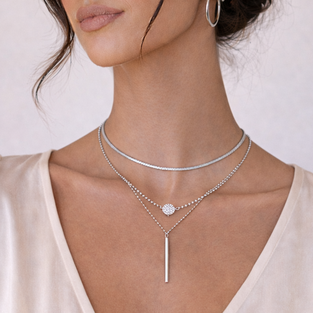 model wearing silver layered necklaces