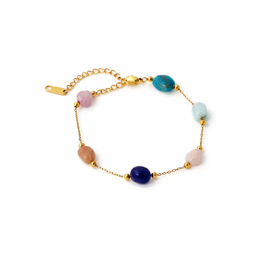 Gold bracelet with multicolored beads on a white background