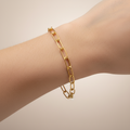 Gold chain bracelet on a white background