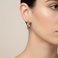 Model wearing a silver hoop